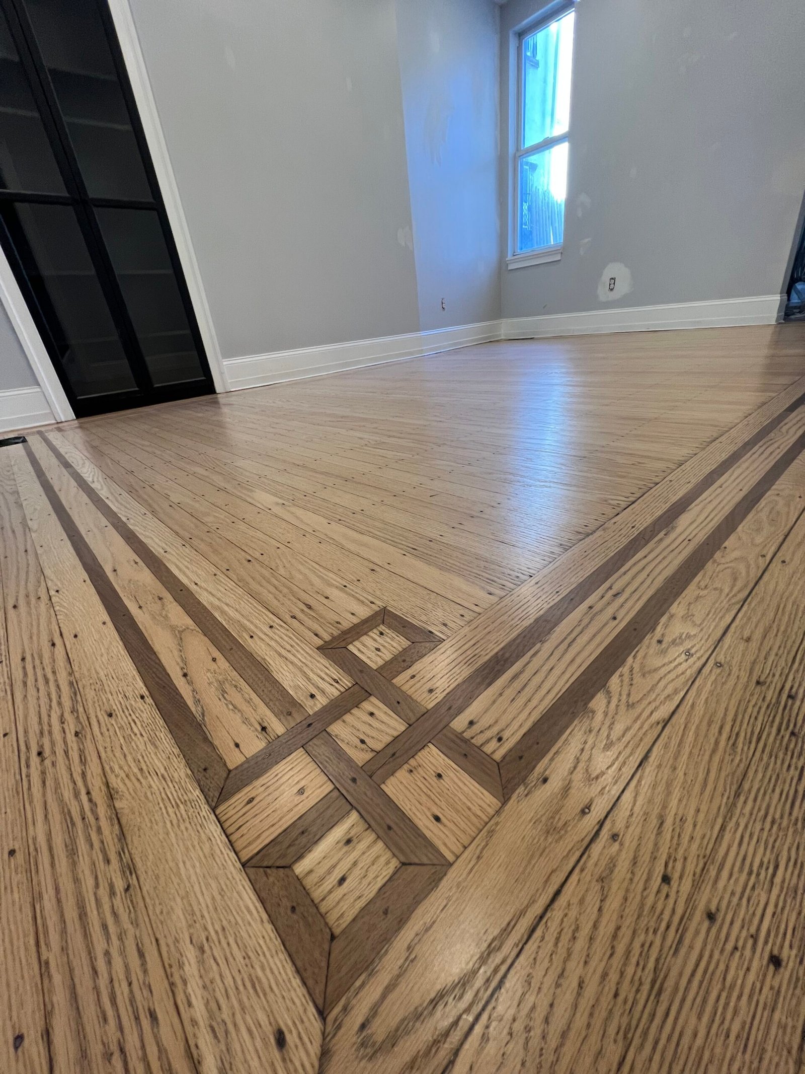 Refinished hardwood floors with smooth even finish and renewed color