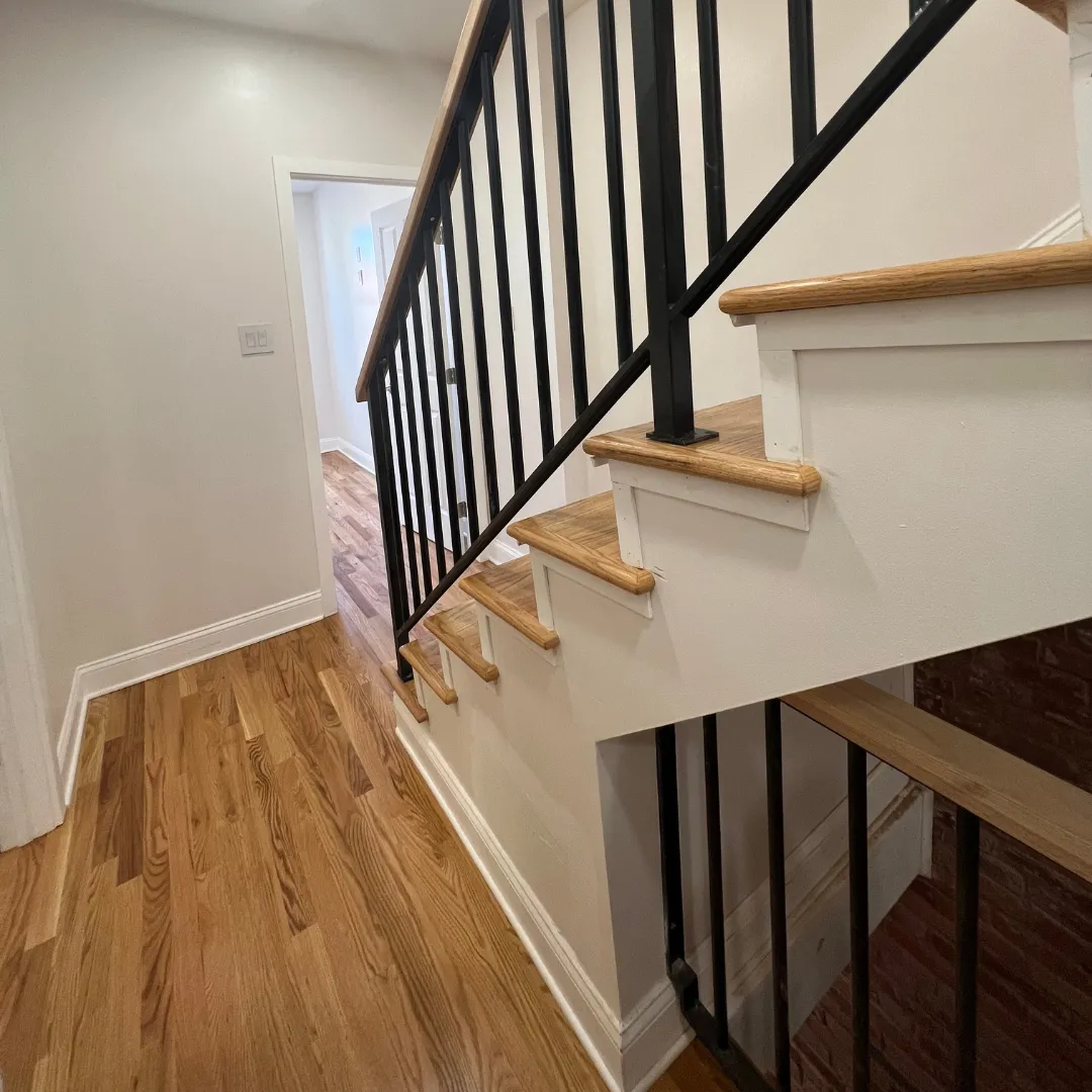 Hardwood flooring installed with a smooth, uniform look in a bright room