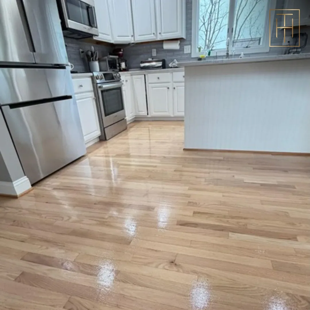 Dark Hardwood Floor Stain in Modern Kitchen Refinished red oak hardwood floor with glossy finish in modern Wayne PA kitchen with stainless appliances