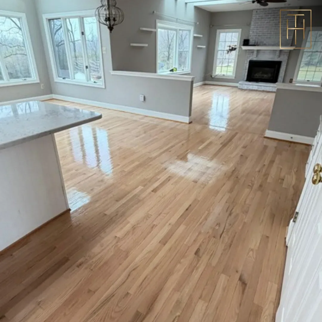 Light Hardwood Floor Stain in Open Concept Home Refinished red oak hardwood floor flowing through open-concept kitchen and living room in Philadelphia home