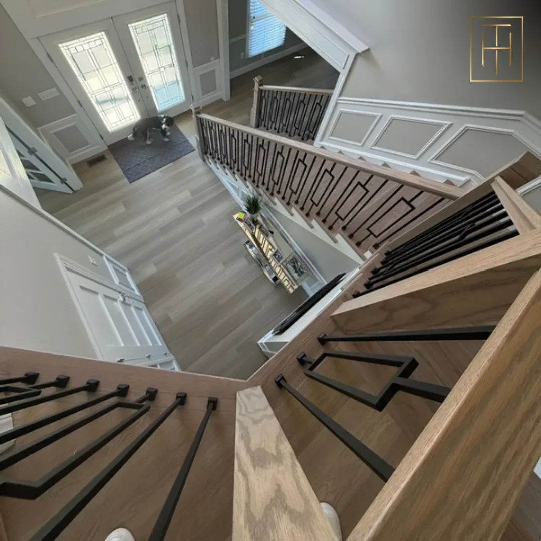 White oak stair treads viewed from above showing entrance vinyl plank flooring in Villanova PA home