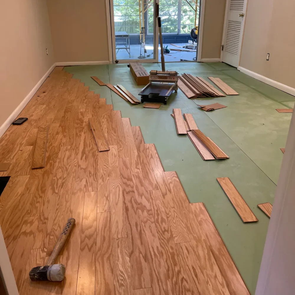 Laminate flooring installation project by Tesla Hardfloor showing durable and stylish wood-look finish.