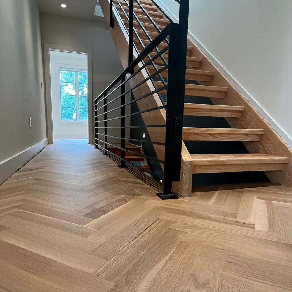 Modern hardwood stairs with herringbone flooring installation in Pennsylvania home