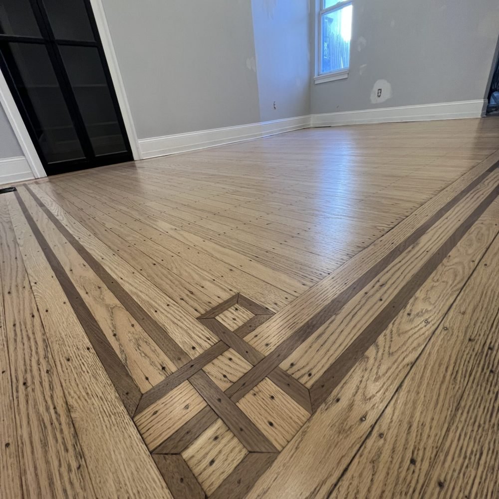 Custom hardwood floor inlay design during refinishing project in Pennsylvania home